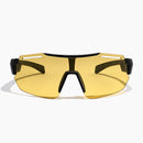 Fast Lane Sunglasses in black and acid feature a yellow-tinted, single large lens with an angular black frame and wide arms, offering UV400 protection for optimal eye safety; shown against a plain white background.