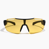 Fast Lane Sunglasses in black and acid feature a yellow-tinted, single large lens with an angular black frame and wide arms, offering UV400 protection for optimal eye safety; shown against a plain white background.