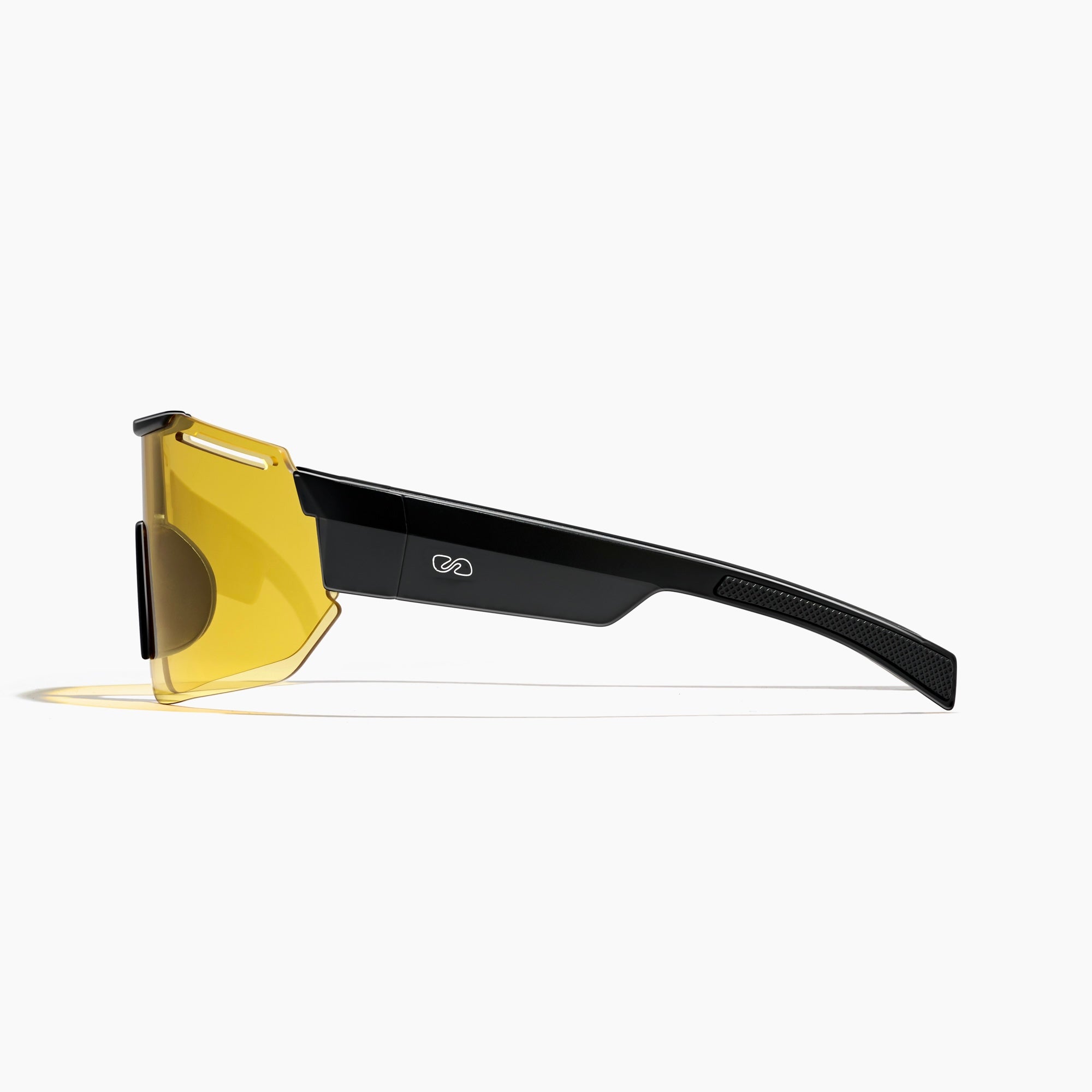 Side view of Fast Lane Sunglasses in black and acid, featuring futuristic, shatter proof design with yellow lenses and thick black arms, offering UV400 protection, displayed on a white background.