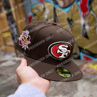 Fitted San Francisco 49ers T.O. Pinky hat in walnut, featuring raised embroidered logo and 1996 Draft patch with metallic details.