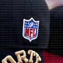Close-up of the NFL patch on dark fabric with gold embroidery, showing the PREORDER ONLY San Francisco 49ers Golden Ticket V2 59Fifty Fitted Hat in black and cardinal; “PREORDER ONLY” text overlays the image.