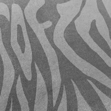 Black and white image of a zebra print pattern, featuring irregular, wavy stripes resembling those found on a zebra’s coat—a striking design reminiscent of the unique textures you’d find on the SOF Watermark Script Tee in gradient grey.