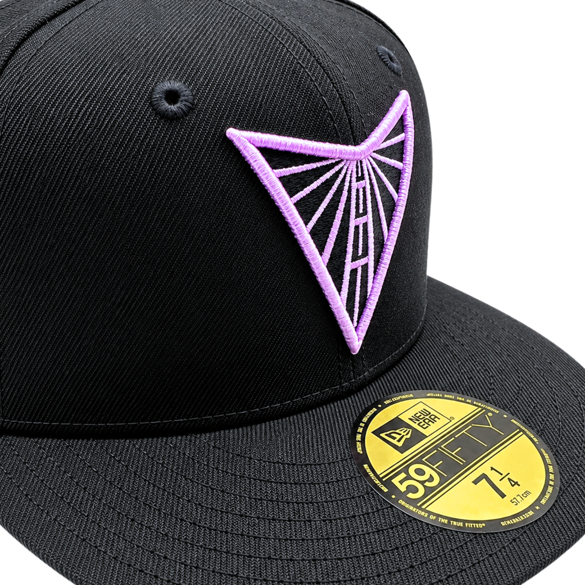 A black Golden State Valkyries 59Fifty V’s Up After Dark Fitted Hat featuring a purple geometric embroidered logo on the front crown and a gold-colored size sticker on the flat brim.