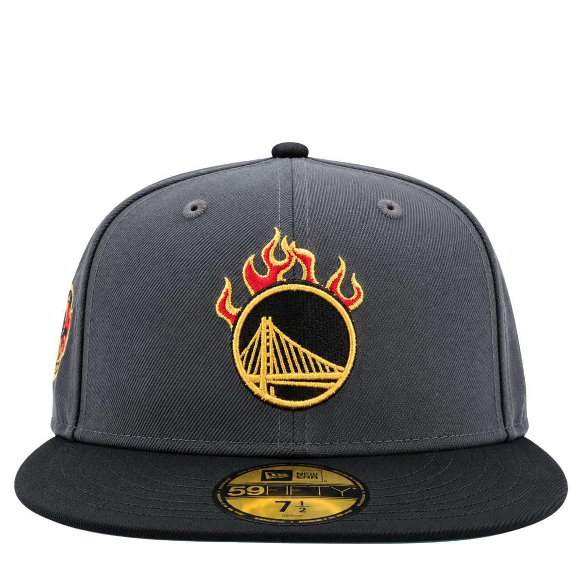 Golden State Warriors On Fire 59Fifty Fitted Hat in graphite and black, a dark grey cap with a black brim and an NBA Jam inspired Warriors logo topped with red and yellow flames.