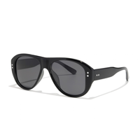 Austin Sunglasses in elysium double black and ink polarized, featuring oversized black aviator frames with dark, polarized lenses and small decorative studs.