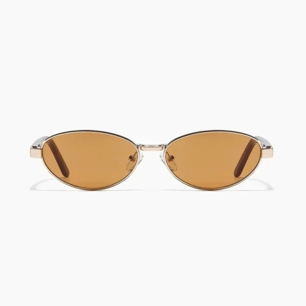 Cherry Sunglasses in polished gold and hazelnut, featuring an oval gold metal frame with light brown lenses.