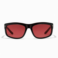 Ryder Sunglasses in elysium double black and cherry featuring a black rectangular frame, red-tinted lenses, and small star accents on the corners.