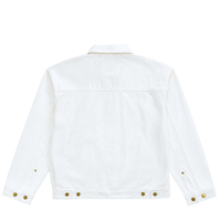 The Selvedge Pleated Denim Jacket in white is shown from the back, featuring brass buttons on the cuffs and waistband adjusters. Its simple design with a straight yoke and classic collar reflects timeless workwear style.
