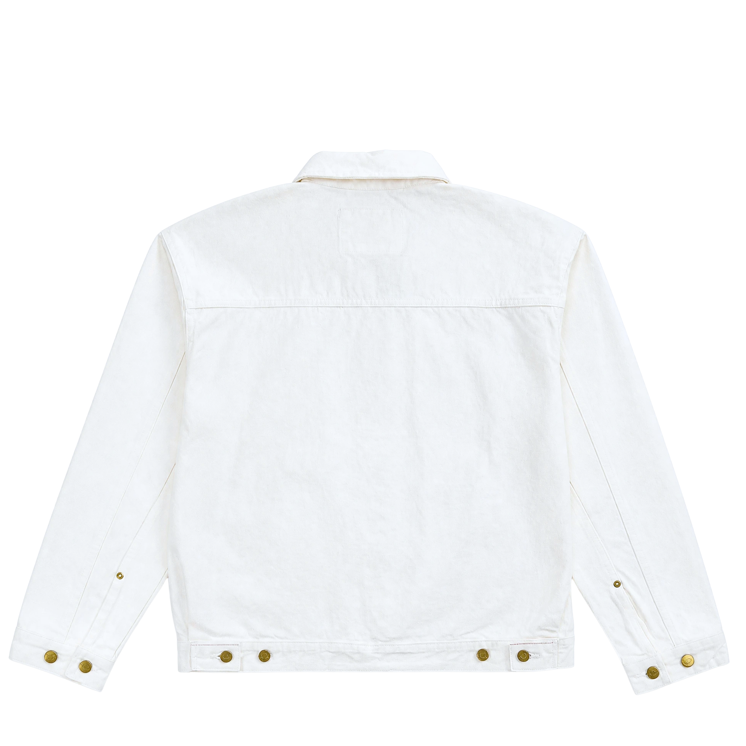 The Selvedge Pleated Denim Jacket in white is shown from the back, featuring brass buttons on the cuffs and waistband adjusters. Its simple design with a straight yoke and classic collar reflects timeless workwear style.