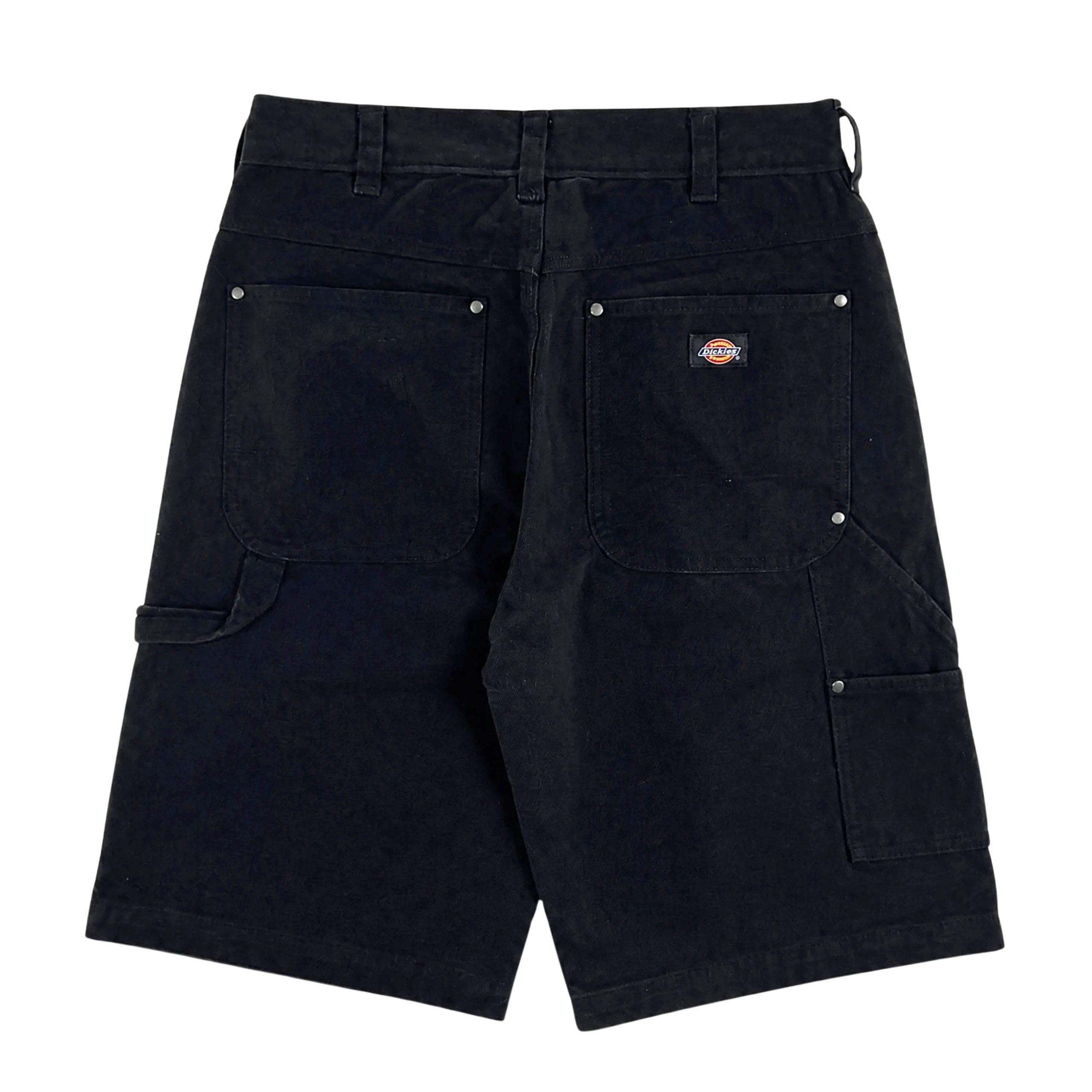 Back view of black Double Knee Canvas Shorts with large pockets, hammer loop on the side, metal rivets, and a small brand patch above the right pocket.