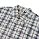 The Springdale Short-sleeve Button-up Shirt by Dickies in egret and blue plaid cotton-linen, with a collar, is shown flat on a white background. The brand label appears inside the collar.