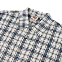 The Springdale Short-sleeve Button-up Shirt by Dickies in egret and blue plaid cotton-linen, with a collar, is shown flat on a white background. The brand label appears inside the collar.