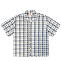 The Springdale Short-sleeve Button-up Shirt in egret and blue features a plaid pattern, spread collar, and logo tags on the chest pocket and bottom hem. Made of cotton linen, it’s shown laid flat on a white background.