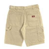 Hickory Stripe Carpenter Shorts in eucalyptus, featuring beige and white stripes, large back pockets, a red and brown Dickies logo patch, and a left-side tool loop—classic workwear style, shown flat on a white background.