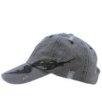 The Everyday Is A Gift Cap in washed black, featuring black embroidered designs on the side and a distressed denim finish, is displayed in a side profile view against a white background.