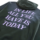 A heavyweight hoodie in distressed faded black, featuring large lilac text that reads “IN LIFE ALL YOU HAVE IS TODAY,” with an hourglass symbol inside the letter O in “YOU.”.