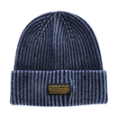 The Ribbed Knit Mantra Beanie in washed navy features a dark ribbed knit design with a folded brim and a yellow patch that reads STATE OF FLUX alongside an inspiring quote. Made from a comfortable rayon blend, this cozy accessory merges style and motivation in one versatile beanie.