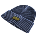 Ribbed Knit Mantra Beanie in washed navy, crafted from a soft rayon blend for comfort, features a dark blue ribbed knit design with a folded brim and a yellow rectangular patch reading “STATE OF FLUX” along with smaller text underneath.