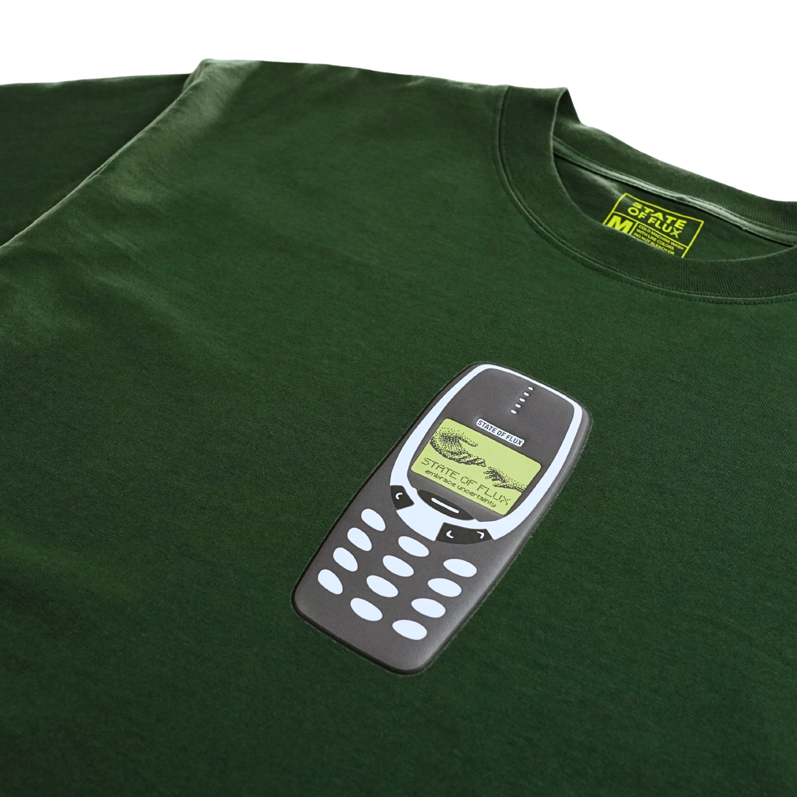 The Answer The Call Tee in forest green is a 100% cotton heavyweight oversized T-shirt, featuring a graphic of a classic Nokia mobile phone with a message on its screen—perfect for layering as streetwear or wearing as your everyday statement tee.