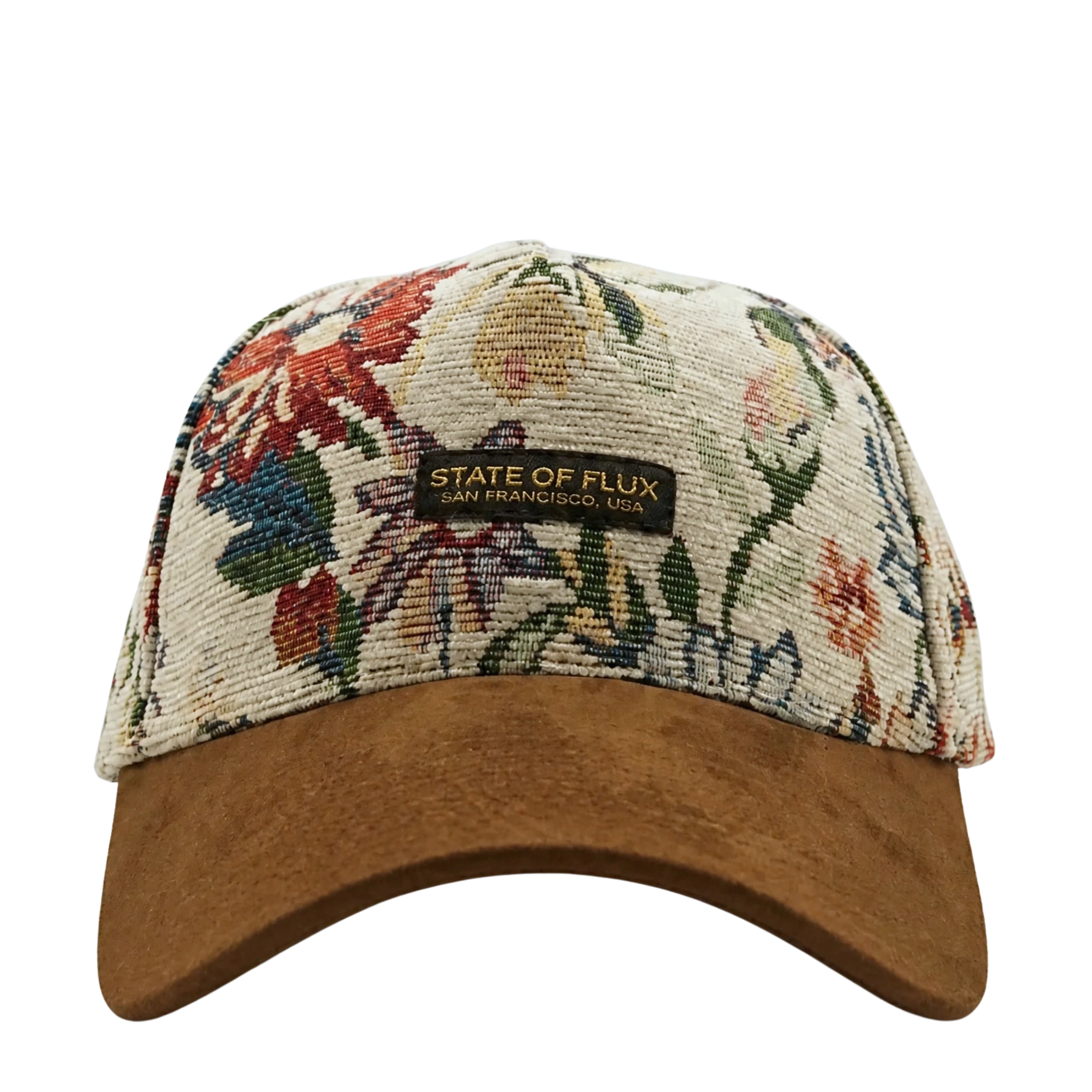 Introducing the Wildflower Strapback Hat in cream and brown—a jacquard woven baseball cap featuring intricate floral artwork and a brown suede brim. The front patch displays “State of Flux, San Francisco, USA.”.