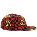 The Zippered Psycapdelic 5-Panel Hat in blood red and bright yellow is crafted from stretch fabric, featuring an abstract squiggle pattern, yellow SDF text, and a red-and-black design, shown here from the side.
