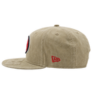 The San Francisco 49ers Big Logo Visor 9FIFTY Snapback Hat in beige is shown from the side, featuring a bold red and black embroidered logo on the left front and a smaller red New Era emblem on the side. The visor boasts subtle stitching details, giving this cap a timeless style that’s ideal for any vintage 49ers hat collection.