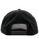 A close-up view of the back of the San Francisco Giants All-Star Trolley Corduroy 19Twenty Snapback Hat in black and orange, highlighting its golfer-style design, adjustable strap, and gray inner lining.
