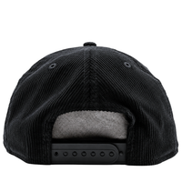 A close-up view of the back of the San Francisco Giants All-Star Trolley Corduroy 19Twenty Snapback Hat in black and orange, highlighting its golfer-style design, adjustable strap, and gray inner lining.