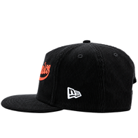 The San Francisco Giants All-Star Trolley Corduroy 19Twenty Snapback Hat features black corduroy with orange accents, a flat brim, red Classic text on the front, and a white embroidered New Era logo on the left side—reminiscent of a classic Giants snapback.