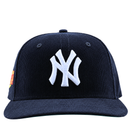 A navy corduroy New York Yankees Seinfeld 59Fifty fitted hat featuring a white logo on the front, shown from the front view.