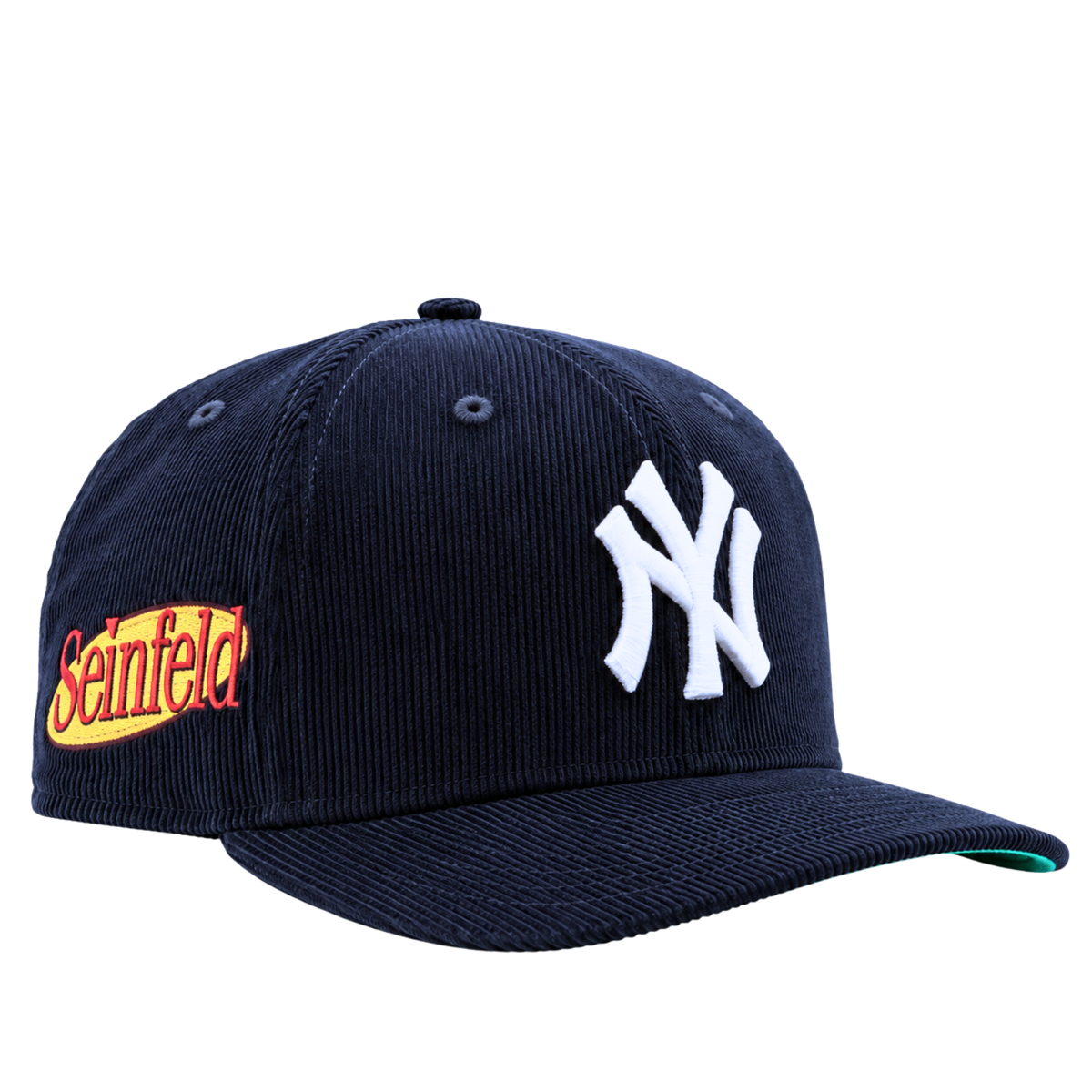 Introducing the New York Yankees Seinfeld Corduroy 59Fifty Fitted Hat in navy and white—a stylish corduroy baseball cap featuring a classic white NY logo on the front and a vibrant yellow and red Seinfeld patch on the side, blending iconic team spirit with playful nostalgia.