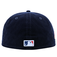A New York Yankees Seinfeld Corduroy 59Fifty Fitted Hat in navy and white, shown from the back, features the MLB logo patch centered near the bottom edge. This classic design evokes a timeless style that fans of both Yankees fitted hats and Seinfeld New Era caps will recognize and appreciate.