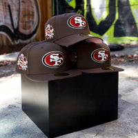 Fitted San Francisco 49ers T.O. Pinky hat in walnut, featuring raised embroidered logos and a pink underbill.