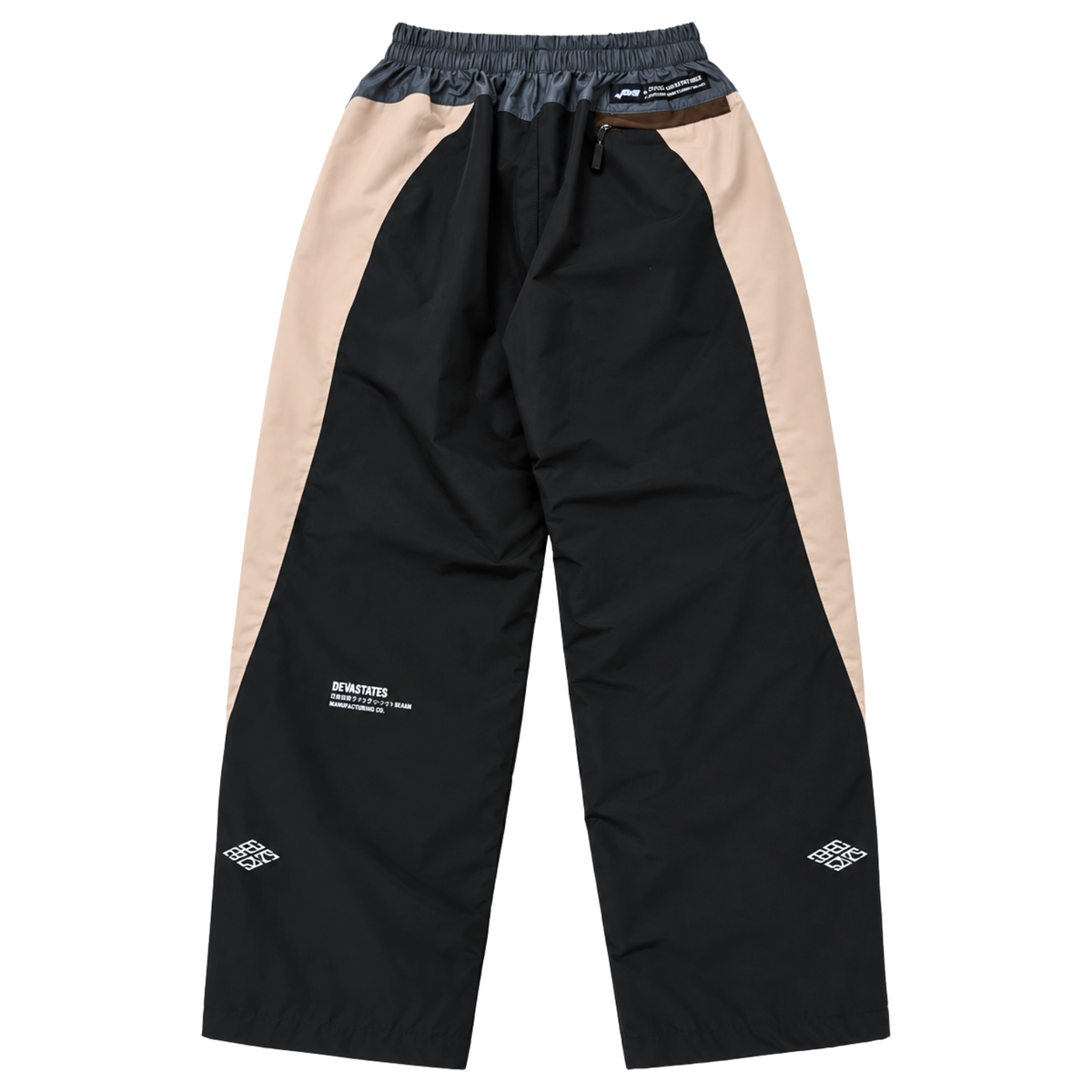 Disorder Track Pants in black and beige nylon featuring an elastic waistband, a zippered back pocket, and white graphic text on the lower legs.