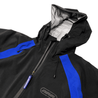 Aegis Shell Jacket in black and royal blue - Devá States - State Of Flux