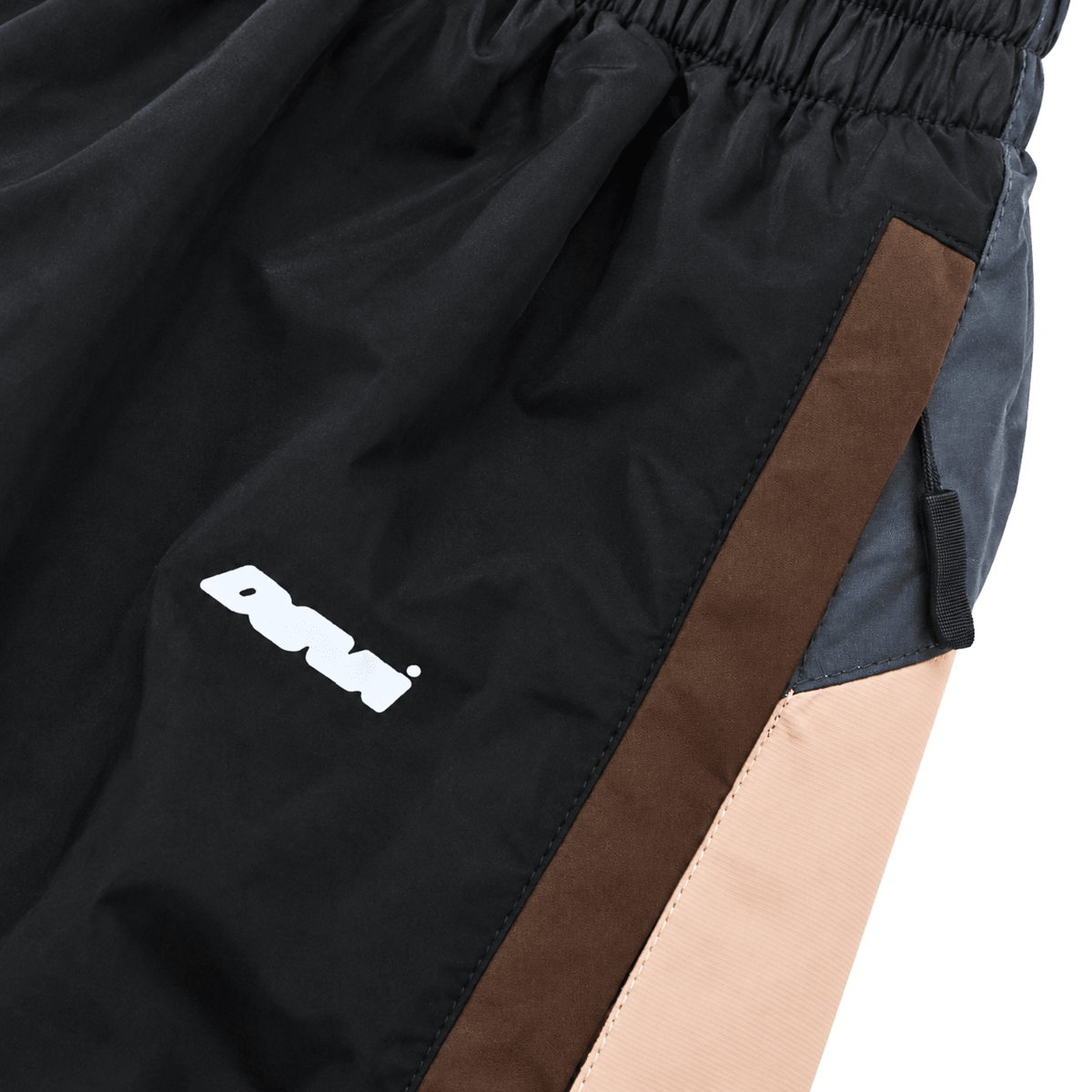Disorder Track Pants in black and beige