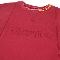 Never Break Embossed Crewneck in maroon - State Of Flux - State Of Flux