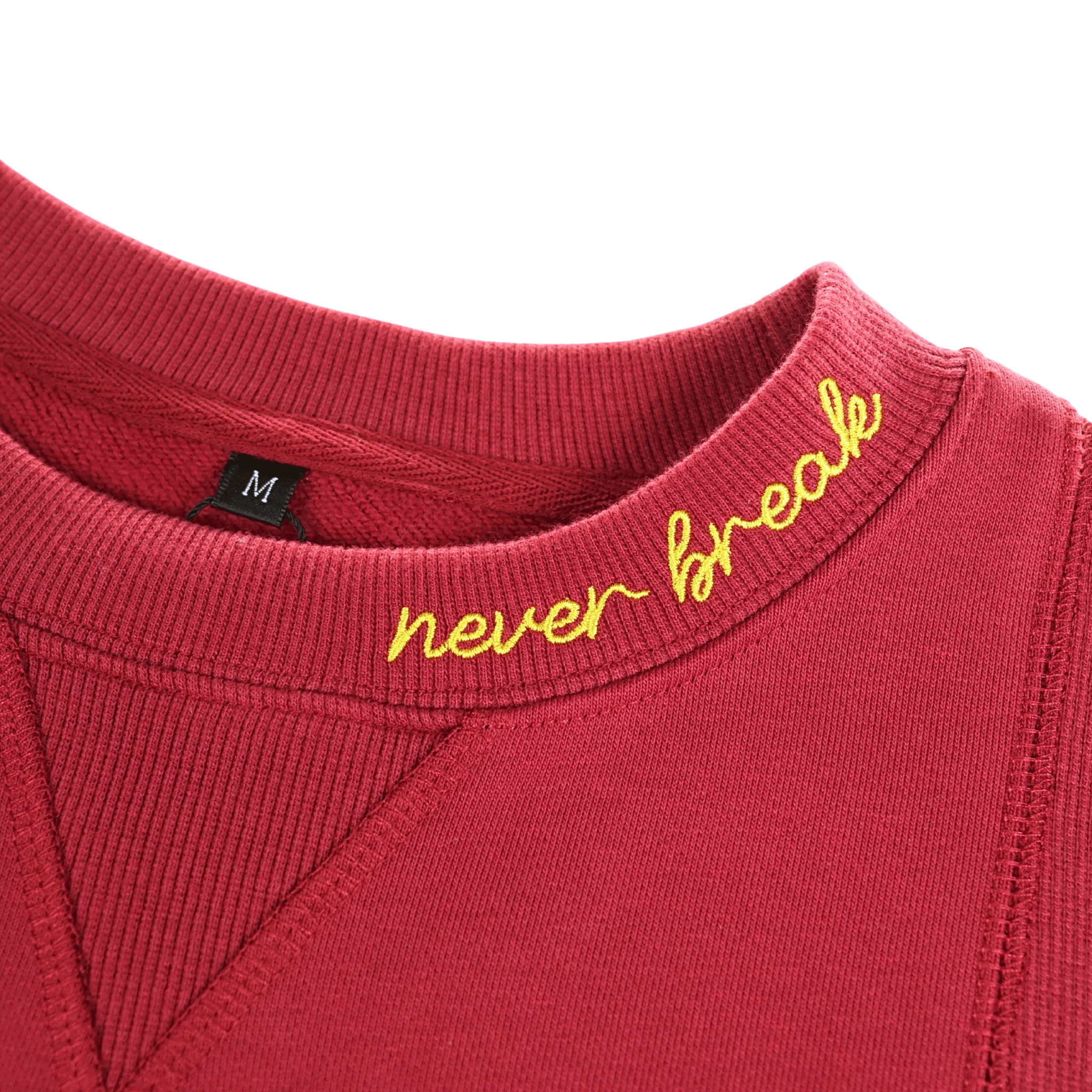 Never Break Embossed Crewneck in maroon - State Of Flux - State Of Flux