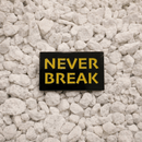 Never Break Pin black and yellow 1.25-inch soft enamel dual-post with black rubber backers