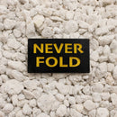 Never Fold Pin black and yellow 1.25in soft enamel dual post with black rubber backers