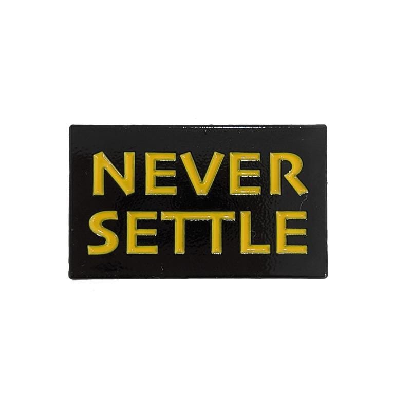 Never Settle Pin in black and yellow