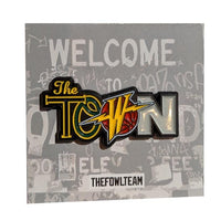 The Town Pin multi 1.5" hard enamel pin dual-post with black rubber backers blue yellow green grey black orange